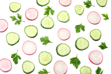 mix of sliced cucumber with sliced radish isolated on a white background top view