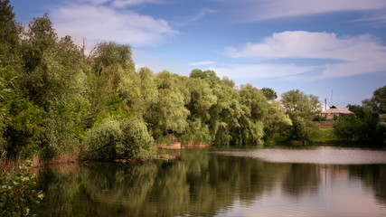 Fototapeta na wymiar Ripples on the river at sunny summer day