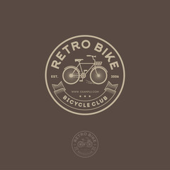 Retro Cycling club emblem. Letters, ribbon and bicycle in the circle.