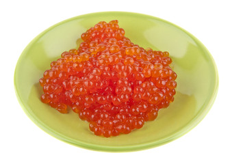 Red caviar in a green plate isolated on a white background