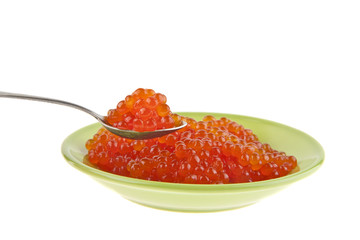 Red caviar in a green plate isolated on a white background
