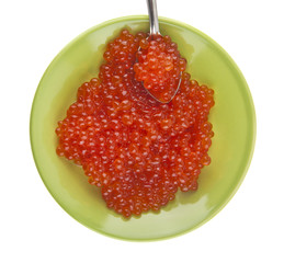 Red caviar in a green plate isolated on a white background