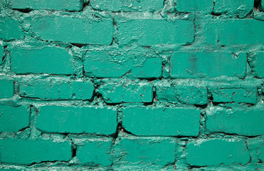 Old green brick wall as a background close-up