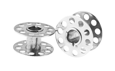 Obraz premium metal reel for threads isolated on white background close-up