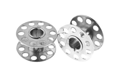metal reel for threads isolated on white background close-up