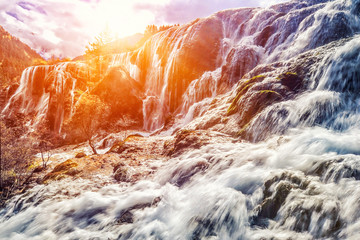 Beautiful landscape waterfall in sunlight
