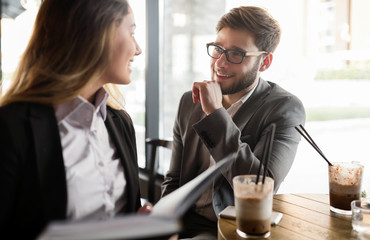 Business colleagues meeting at cafe