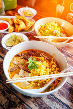 Northern Thai curried noodle soup with chicken meat and spicy coconut milk (Khao Soi Kai)