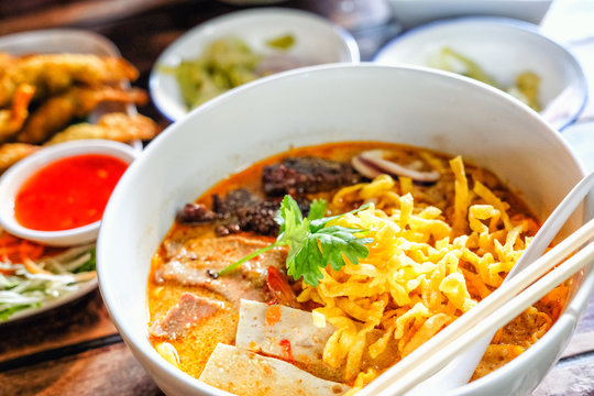 Northern Thai curried noodle soup with chicken meat and spicy coconut milk (Khao Soi Kai)