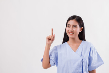 woman patient pointing finger up to blank space