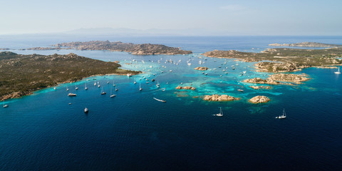 Fototapeta na wymiar Aerial view of sailing yachts near islands between Sardinia and Corsica