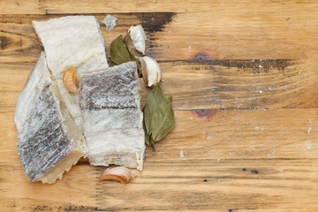 salted dry codfish on wooden background