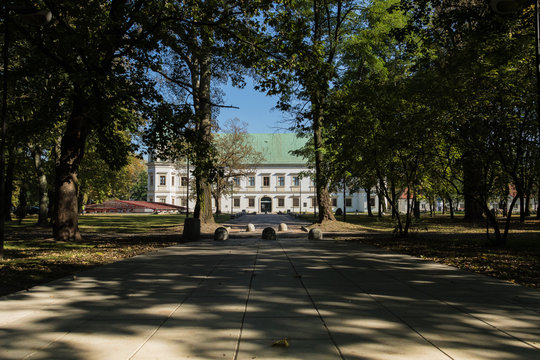 Historical building of the Warsaw Ujazdow Castle  at the end of the shady path in the park