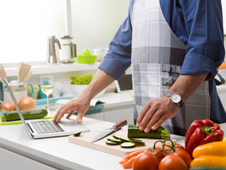Man cooking and learning new recipes