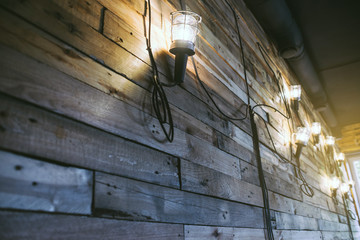 Loft styled wooden texture with lamps and lanterns