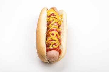 Hot dog with ketchup and mustard on white background. Isolated. Fastfood.