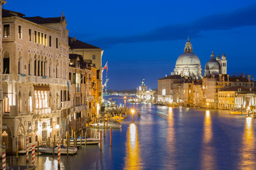 Obraz na płótnie Canvas Basilica Santa Maria della Salute, Punta della Dogona and Grand Canal at blue hour sunset in Venice, Italy with reflections.