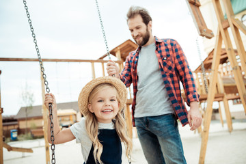 Obraz premium child swinging on swing