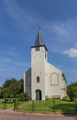Fototapeta na wymiar White church in the Groningen town of Feerwerd