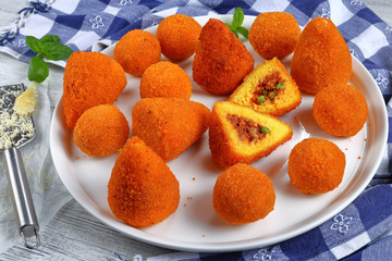 saffron rice cone stuffed with meat
