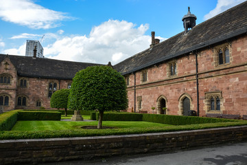 A nice square with trees and hedges next to Chetham's library in Manchester