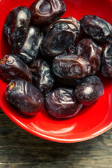 Dates on wooden background