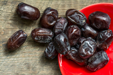 Dates on wooden background