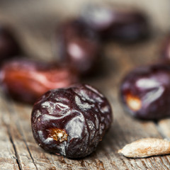 Dates on wooden background
