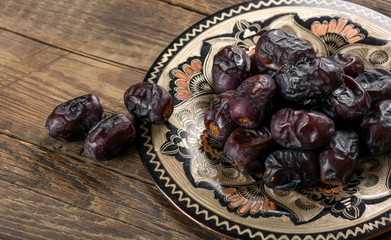 Dates on wooden background