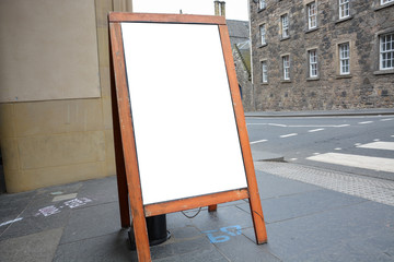 Blank ad space on wooden stand in the street
