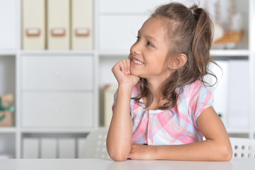 girl sitting at table