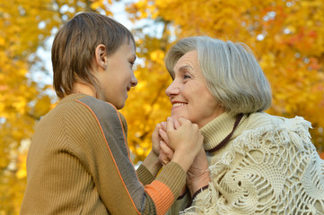 grandmother  and grandson holding hands