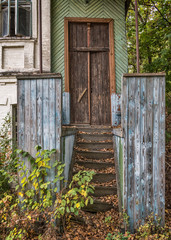 Wooden stairway to a abandoned house in Chernobyl nuclear disaster area.