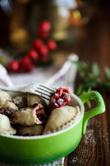 sweet dumplings with cherries in a bowl