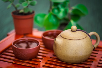 Tea ceremony near flowers. Cutlery
