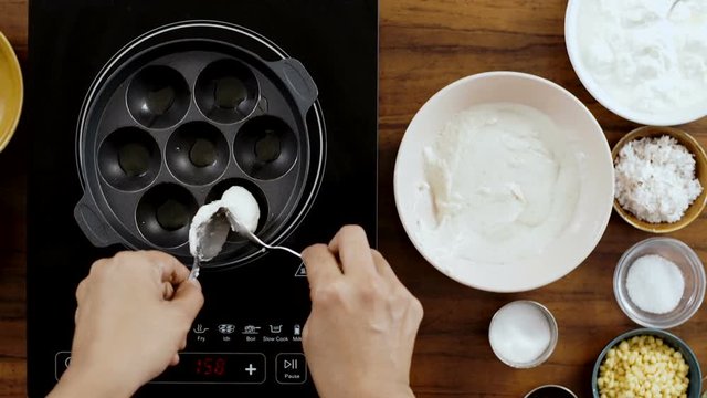 Traditional Indian Dish Cooking in a Paniyaram Pan-Top Angle Shot