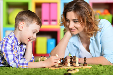 Fototapeta premium young mother playing with son 