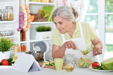 woman reading recipe on laptop 