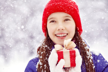 teenage girl with a gift in their hands