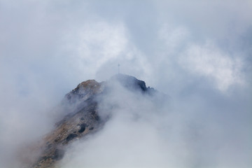 Tourists on the top of Giewont Mountain in High Tatras, Poland