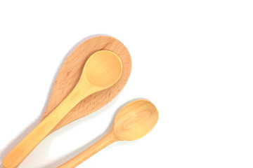 Simple wooden spoons on white background with copy space