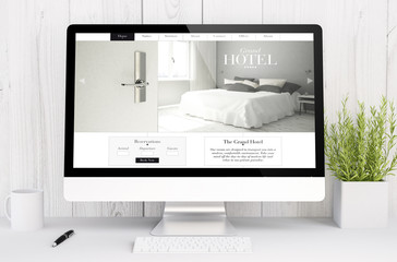 white workspace with computer hotel website