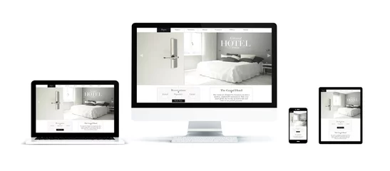 Fotobehang realistic devices isolated with hotel landing page © MclittleStock