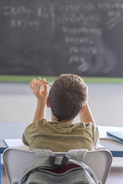 Student attending in a  classroom during a lesson