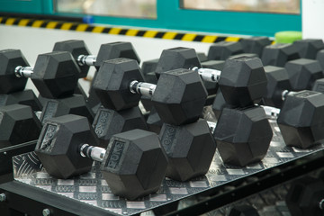 Fitness room. Energy for the day. Gym. Gymnasium with sports equipment. Dumbbells, barbells,...