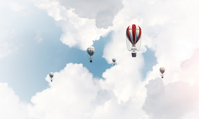 Flying hot air balloons in the air.