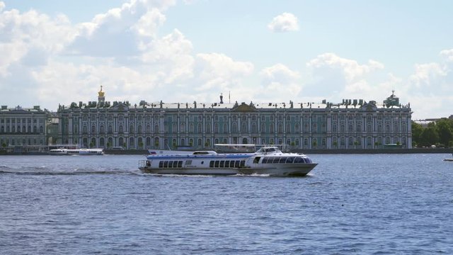 The passenger hydrofoil boat swims in front of the Hermitage