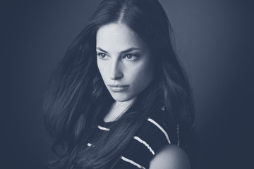 sensual dark hair young woman portrait in bw studio shot