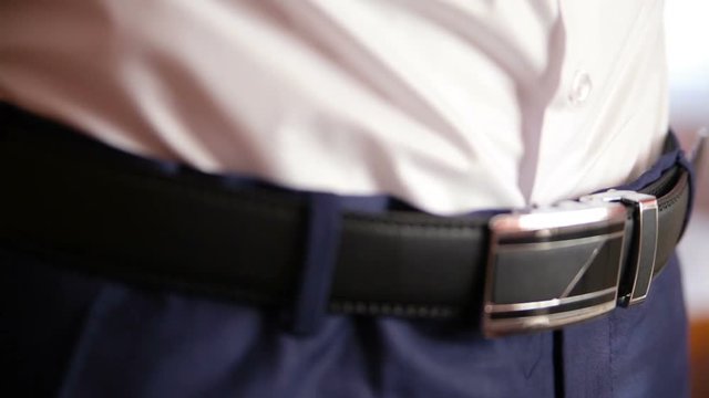 Man wear belt in the room