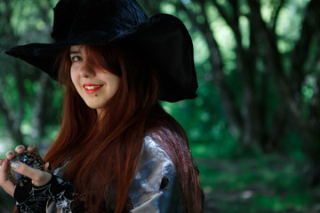 Photo of witch in black hat